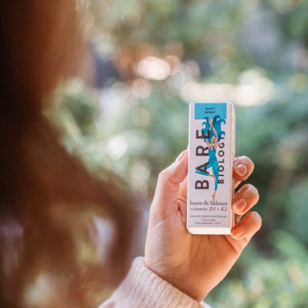 Boxed vitamin D spray by Bare Biology held in hand